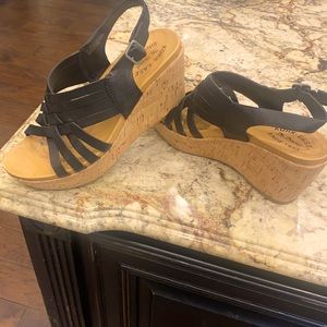 Kork Ease Wedge. Only worn a few times. Like new black leather wedge shoe.